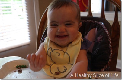 baby led weaning- squinchy face with ketchup