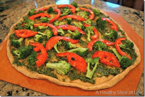 homemade pesto pizzas- applying veggies