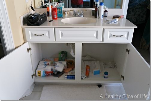 home organization challenge- his bathroom cabinet- before