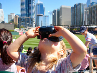child eating dippin dots baseball
