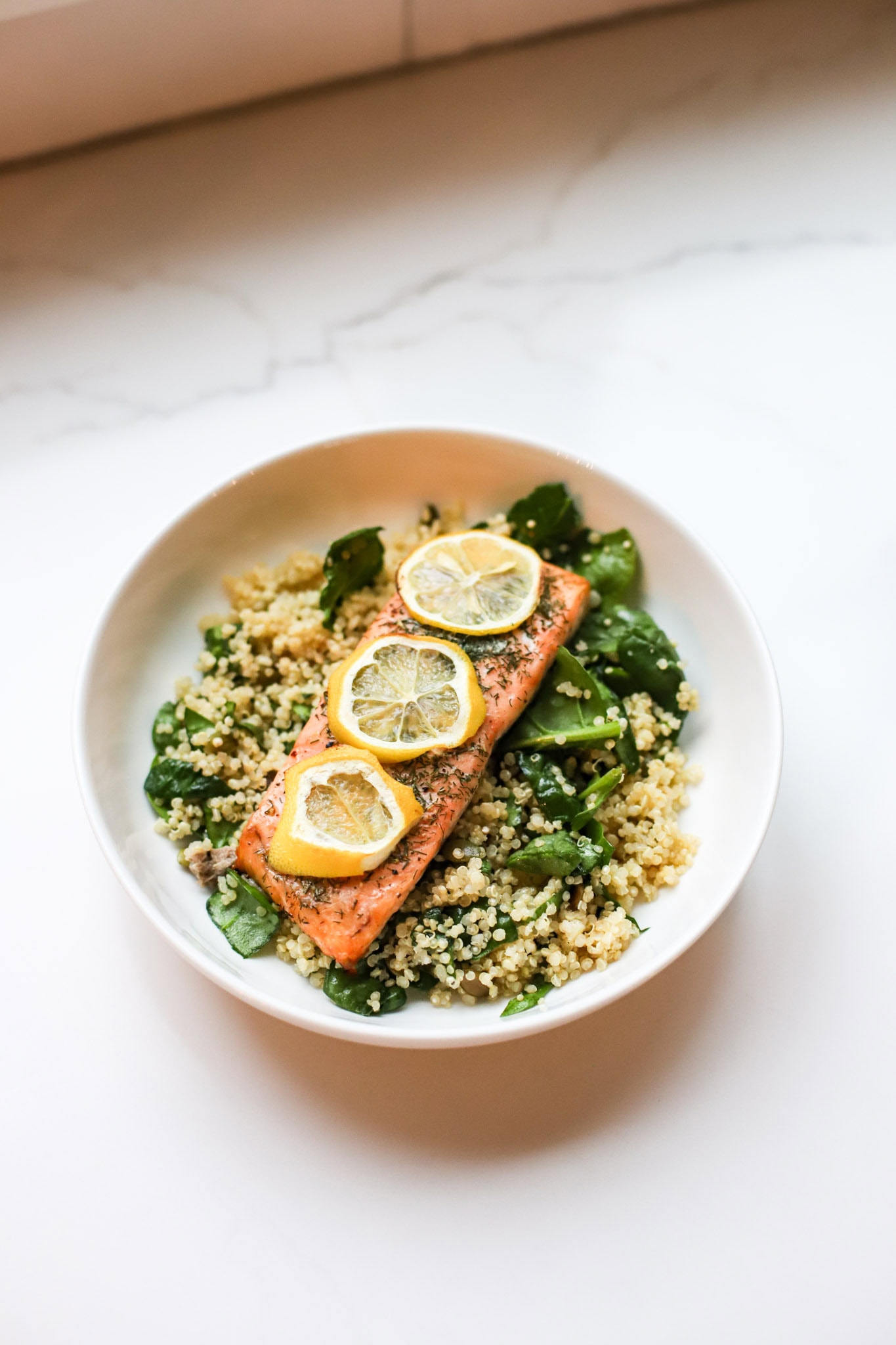 Lemon dill salmon over spinach quinoa